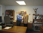 Paul Davis (left), Plum Creek's general manager for the New England Region, with Edward Ashworth, dean of the College of Natural Sciences, Forestry and Agriculture