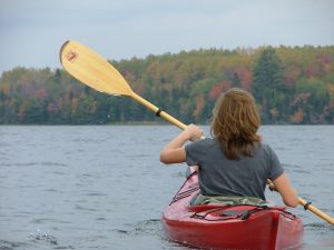 woman paddling a canoe