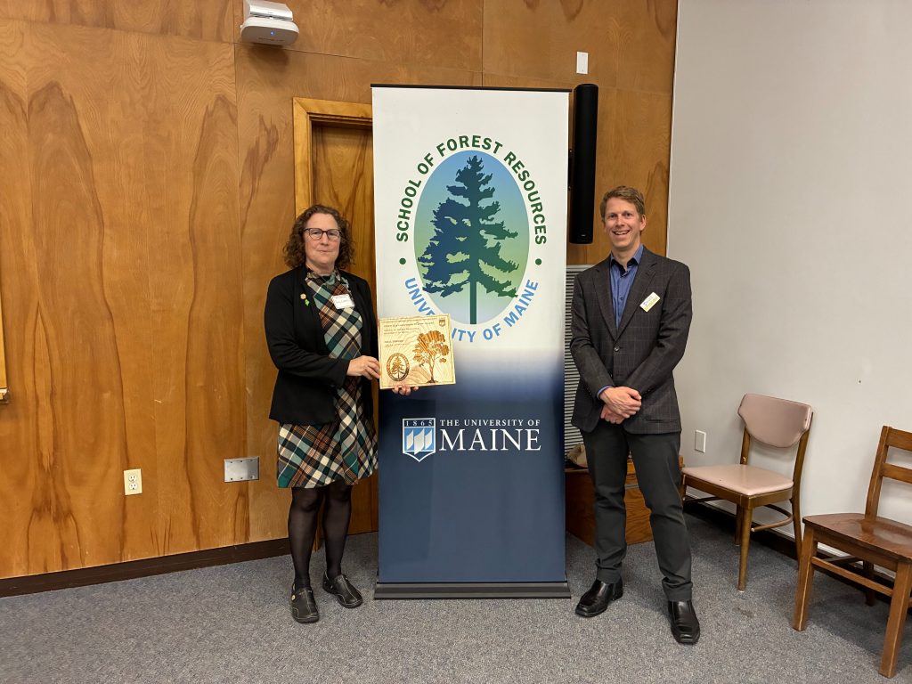 Patty Cormier recieves award.